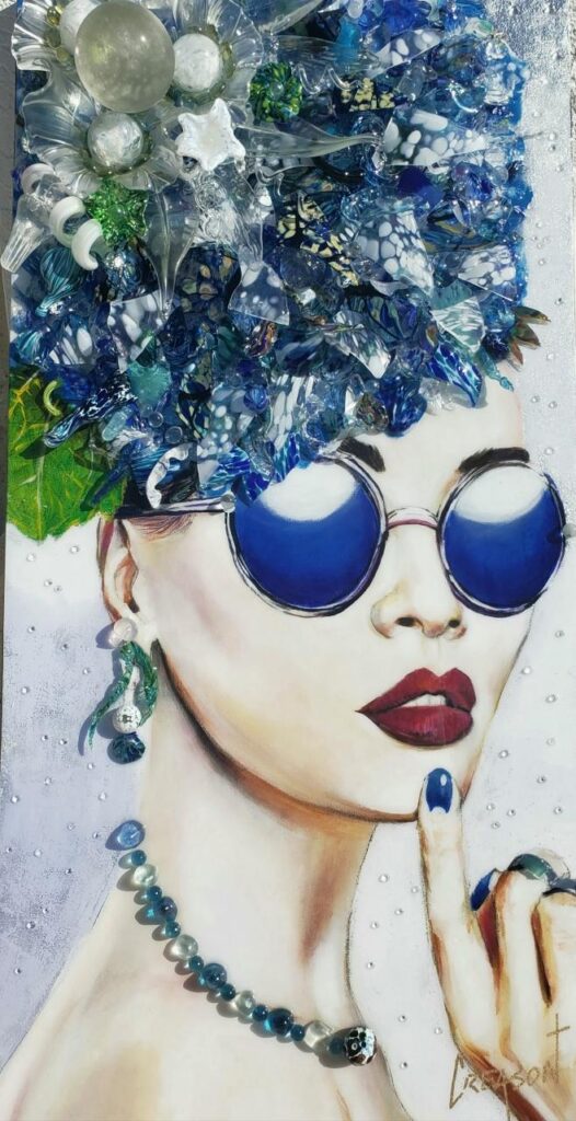 "Delta Turning" limited edition: a lady with a huge blue feathered hat (made of glass), and blue sunglasses